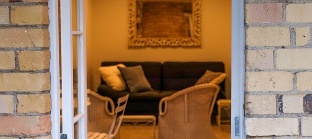 Central Devonport, French country meets heritage in this garden view apartment. in Devonport