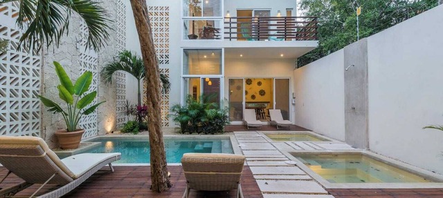 Experience tropical luxury in our villa with pools, lush surroundings, and concierge in Aldea Zama in Tulum